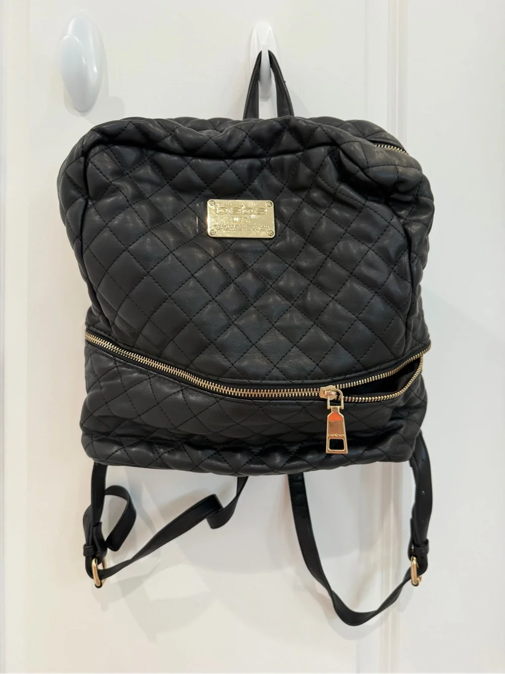 bebe Quilted Black Backpack with Gold Plaque